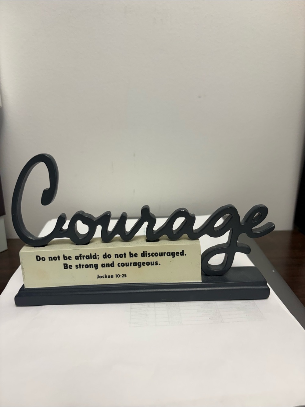 inspirational tabletop sign is a “Courage" plaque.